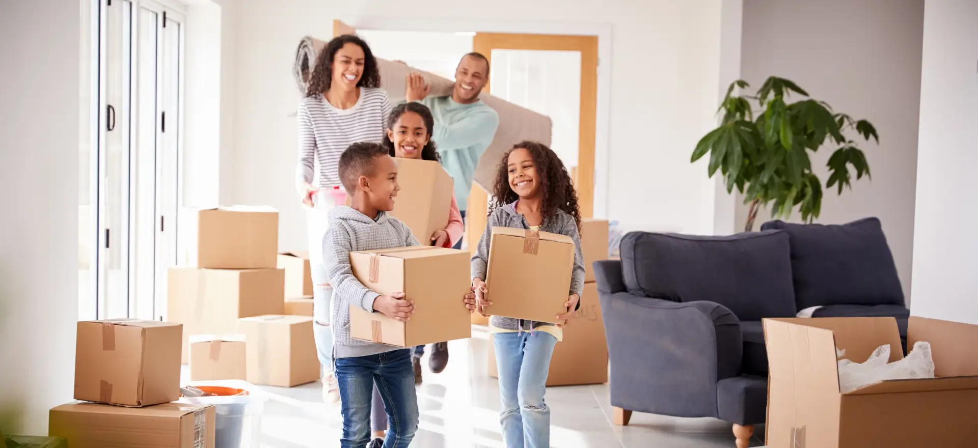 Happy family moving in to their new home thanks to Jet Mortgage LLC